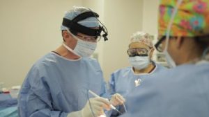 Dr. Lawton & team wearing masks during a surgery